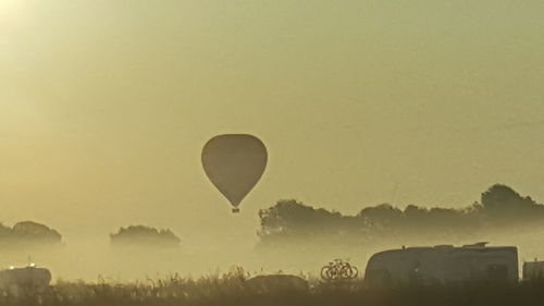 Silhouette of hot air balloon against clear sky