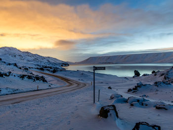 Snow covered mountains against sky during sunset