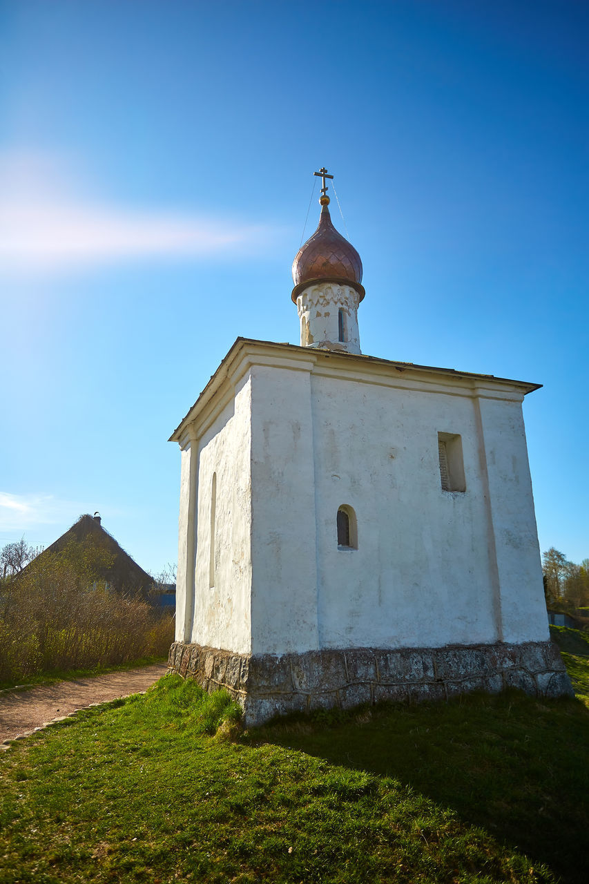 VIEW OF CHURCH TOWER AGAINST BLUE SKY