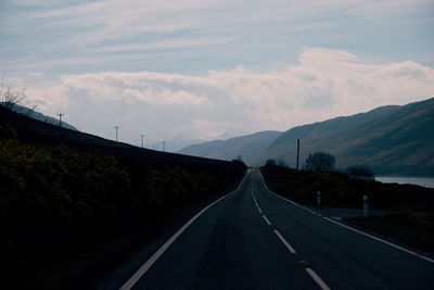 Empty road against sky