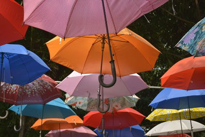 Low angle view of umbrellas hanging at market stall