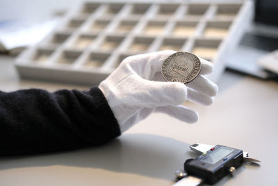 Close-up of hand holding camera