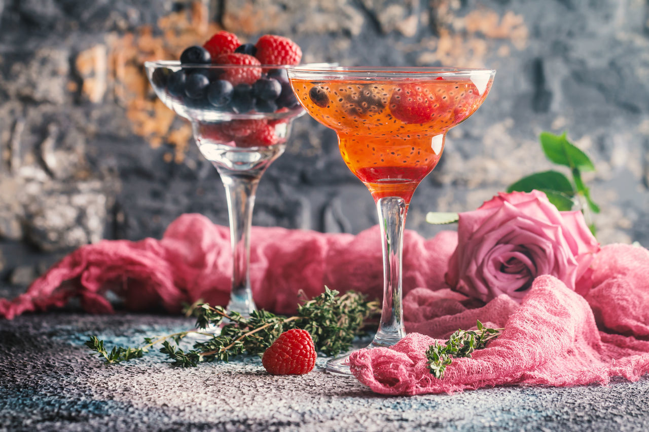 CLOSE-UP OF RED WINE GLASS WITH ICE CREAM IN CONTAINER ON FLOOR