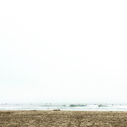 Scenic view of beach against clear sky