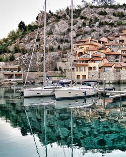 Moored yachts with water reflection