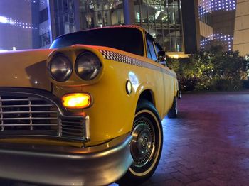 Vintage car on street at night