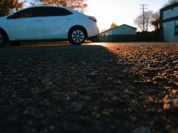 Close-up of car on road