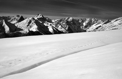 Scenic view of snowcapped mountains against sky