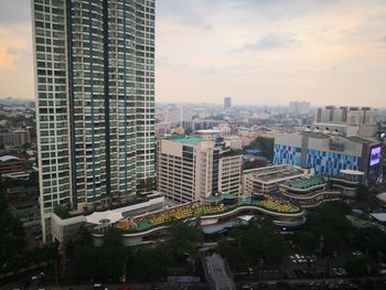 High angle view of buildings in city against sky