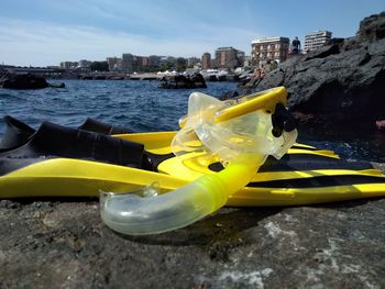 Yellow by sea against sky in city