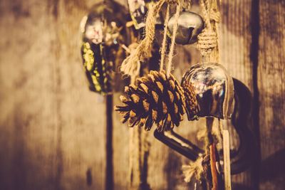 Pine cone and bells hanging during christmas