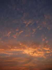 Low angle view of dramatic sky during sunset