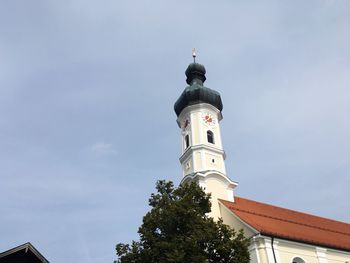 Low angle view of church against blue sky