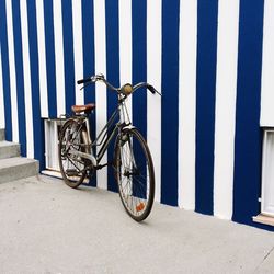 Bicycle parked against wall