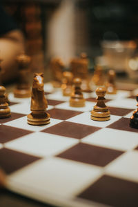 Close-up of chess pieces on table