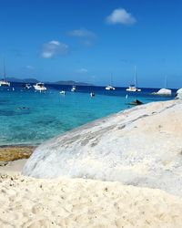 Boats moored in sea