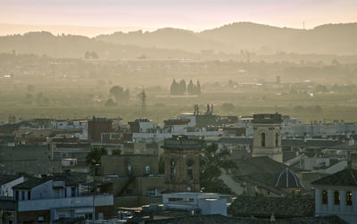 High angle view of townscape against sky at sunset