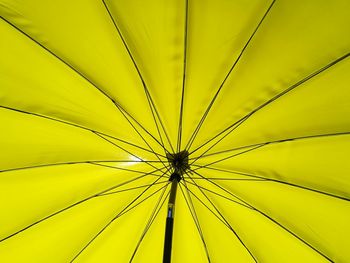 Low angle view of yellow umbrella