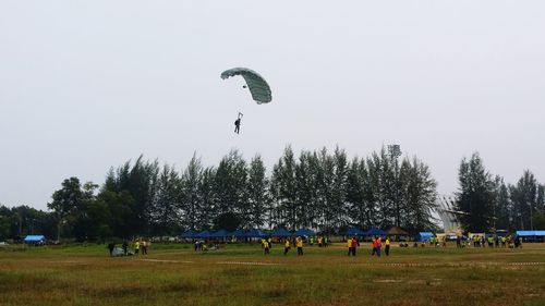 People on field against sky