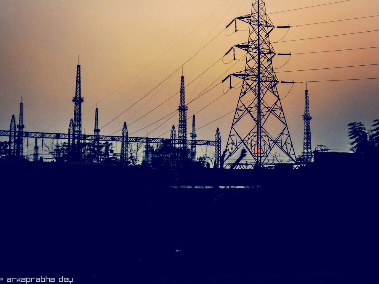 sunset, silhouette, architecture, built structure, building exterior, connection, city, crane - construction machinery, development, sky, clear sky, tall - high, tower, construction site, electricity pylon, dusk, orange color, crane, technology, copy space