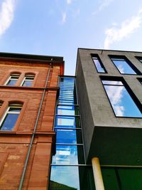 Low angle view of building against cloudy sky