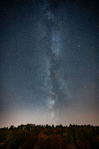 Scenic view of star field against sky at night