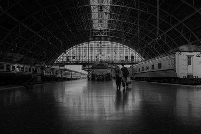 Long exposure of people walking on railroad station platform in bangkok thailand