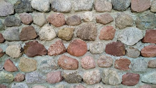 Stones fixed with cement mortar. a wall of boulders