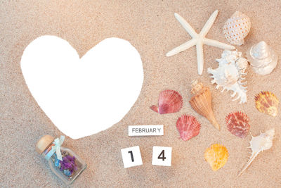 Close-up of heart shape on sand