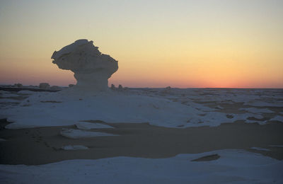 Scenic view of sea against clear sky during sunset