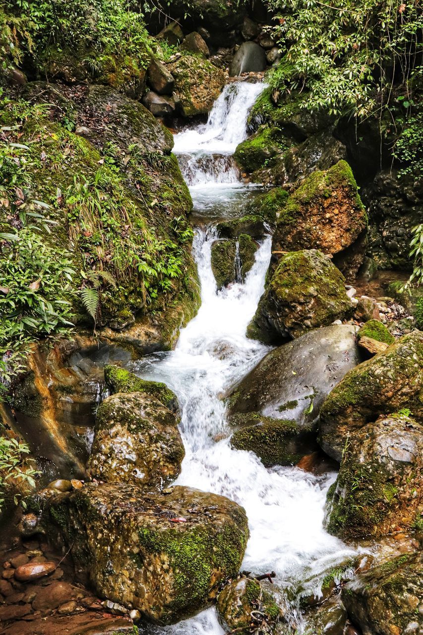 STREAM FLOWING THROUGH ROCKS