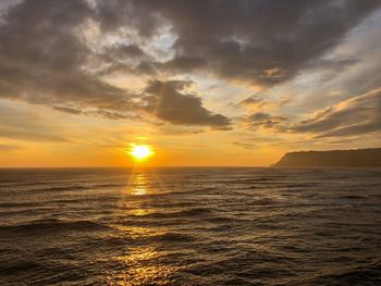 Scenic view of sea against sky during sunset