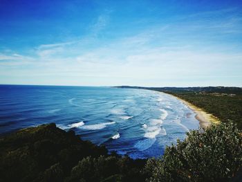 Scenic view of sea against blue sky