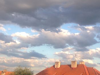 High section of building against cloudy sky