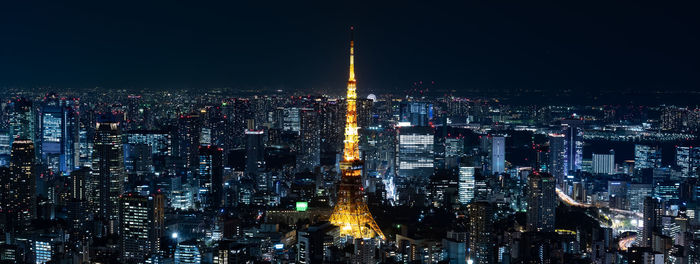 Aerial view of city lit up at night