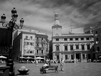 People in city against clear sky