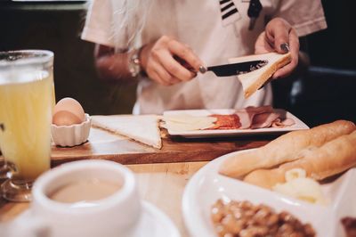 Midsection of woman having food