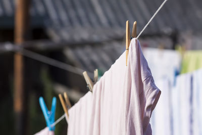 Close-up of clothes hanging on rack