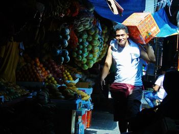 People for sale at market stall