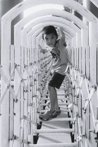 Portrait of boy playing at jungle gym