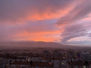 High angle view of buildings against sky at sunset