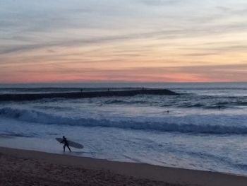 Scenic view of sea at sunset