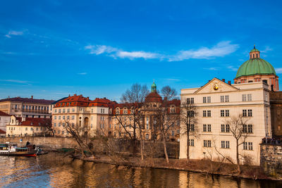 Boat on vlava river at sunset in prague