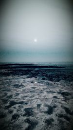 Scenic view of sea against sky at night