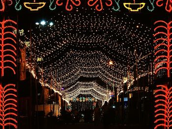 Illuminated lanterns hanging at night