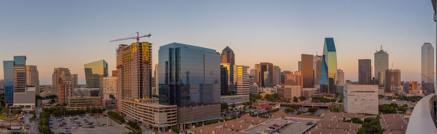 Modern buildings in city against sky