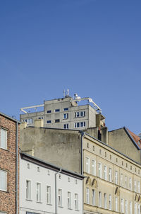 Low angle view of buildings against clear sky