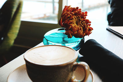 Close-up of coffee cup on table