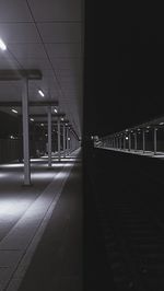 Empty railroad station platform at night