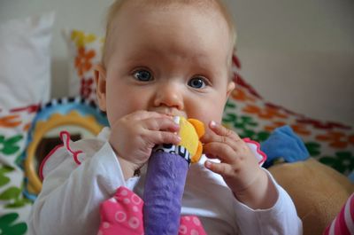 Close-up portrait of cute boy eating food